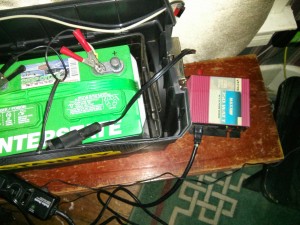 Battery hooked up to a power inverter.