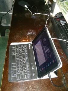 A tablet plugged into a usb multi-charger.